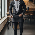 Paullo black and silver African embroidered Senator suit for men by Dupsie's African Fashion featuring a slim-fit Nigerian Senator shirt with matching pants.
