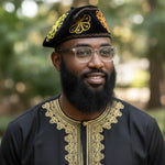 Ranti black velvet Nigerian fila hat for men with yellow and orange embroidery by Dupsie’s African Fashion, premium African hat and African clothing for men