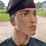 Close-up side view of all-black handwoven Aso Oke kufi hat – luxury African clothing accessory"