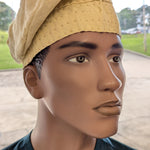 Side view of cream Aso Oke brimless kufi cap – African clothing hat symbolizing purity and dignity in Yoruba fashion.