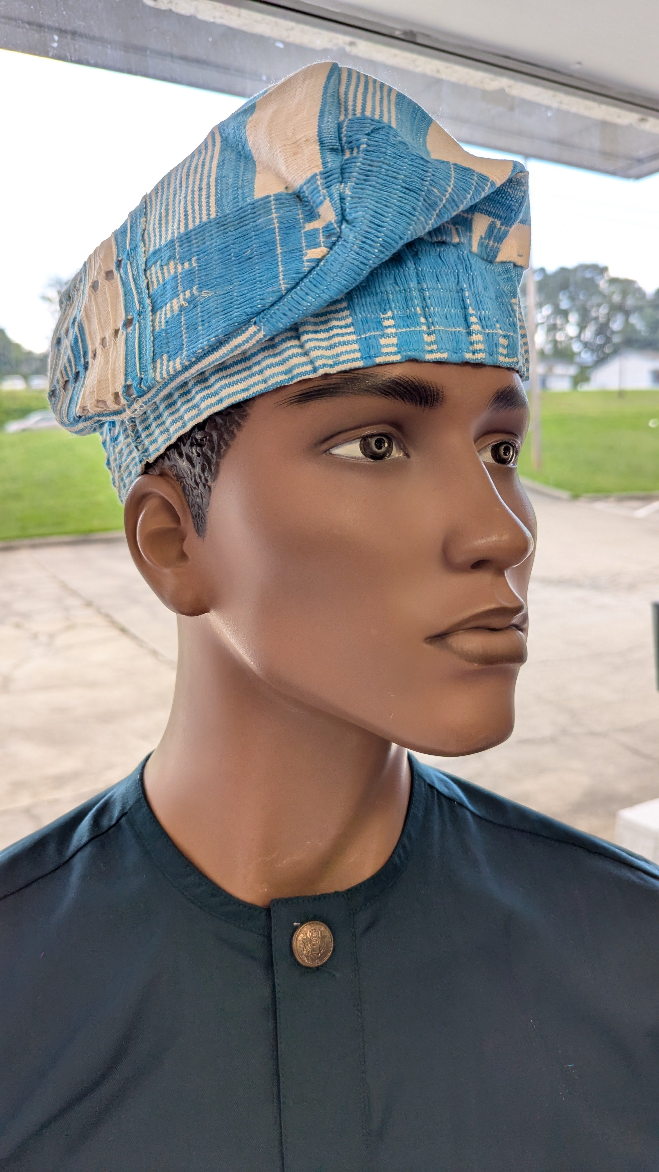  Side view of Ade Témidayo Turquoise African brimless Aso Oke kufi hat with beige woven details – Yoruba fila hat African heritage fashion 