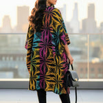 Model showcasing the Sandrah kimono dress at a cultural festival.