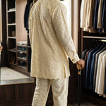 Close-up of silver embroidery on cream African clothing for men