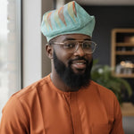Toju mint-green Aso Oke fila African hat for men by Dupsie’s African Fashion with orange gold and silver patterns for Nigerian weddings