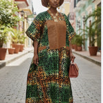 Front view of Toripe Boubou Dress showcasing vibrant green and rust Ankara print.