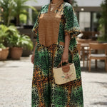 Side view of the Toripe Boubou Dress highlighting Aso Oke trim and flowing silhouette.
