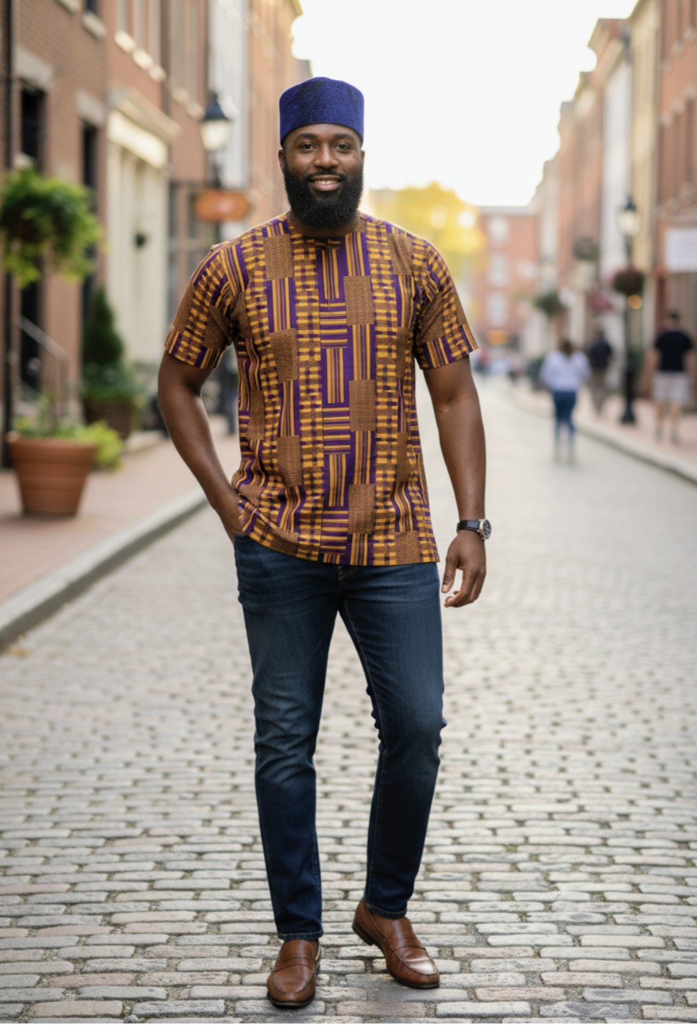 Elegant Kente Dashiki in Purple and Gold, perfect for traditional and contemporary wear.