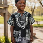 Unisex short sleeve dashiki top showcasing African symbols and artistry.