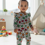 African children's pajama play jumpsuit with colorful Ankara floral print and enclosed feet.