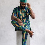 Vayo short-sleeve African Dashiki shirt for men featuring navy blue, green and beige-gold geometric print.