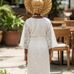 African top and wrap skirt for girls featuring premium Nigerian white cotton lace and traditional African fashion.