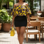 Yellow African print crop top with bold purple floral vine pattern, styled with a Black skirt