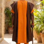 Yoruba groom in Dipo Agbada robe with intricate embroidery.