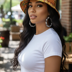 Zifa Kente African Print Bucket Hat front view, showcasing vibrant colors and patterns.