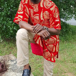 Elegant African Velvet Isiagu shirt worn by a man, featuring luxurious design elements and paired with black pants